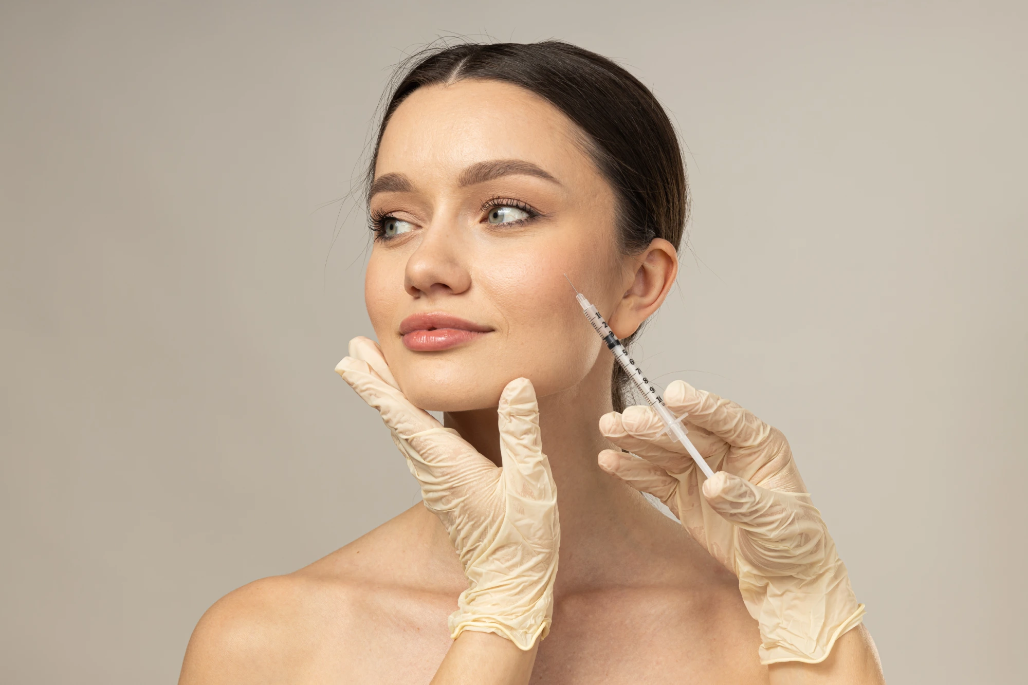 Client receiving Dysport injection at Arcanum Aesthetics in Tampa, FL to smooth fine lines and enhance facial contours